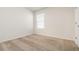 Comfortable bedroom with neutral colors, window, and ceiling fan at 3110 Areca Ave, New Smyrna Beach, FL 32168