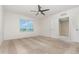 Inviting bedroom with a ceiling fan and view of the neighborhood at 3110 Areca Ave, New Smyrna Beach, FL 32168