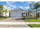 Charming single-Gathering home featuring a two-car garage and well-maintained landscaping at 3110 Areca Ave, New Smyrna Beach, FL 32168