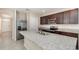 Modern kitchen featuring stainless steel appliances, granite countertops, and ample cabinet space at 3110 Areca Ave, New Smyrna Beach, FL 32168