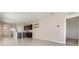 Open-concept living space with tile flooring, a kitchen and neutral wall colors at 3110 Areca Ave, New Smyrna Beach, FL 32168