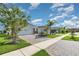 Well-maintained community street view featuring manicured lawns and paved sidewalks at 3110 Areca Ave, New Smyrna Beach, FL 32168