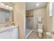 Modern bathroom with a stylish vanity, tiled shower, and a toilet at 3313 Buckland St, Deltona, FL 32738