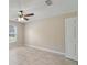 Inviting bedroom with neutral walls, tile flooring, a ceiling fan, and a bright window at 3313 Buckland St, Deltona, FL 32738