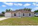 Charming single-story home featuring a well-maintained lawn and attached one-car garage at 3313 Buckland St, Deltona, FL 32738