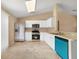 Kitchen featuring stainless steel appliances, white cabinetry, and tile flooring at 3313 Buckland St, Deltona, FL 32738