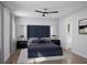 Serene main bedroom featuring a plush bed, ceiling fan, and elegant decor at 3492 Lemon Button Ter, Apopka, FL 32712