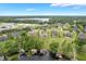 Aerial view of a lakeside community with beautiful homes and mature trees, offering a serene environment at 3531 Oriskany Dr, Orlando, FL 32820