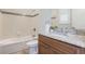 Well-lit bathroom with a granite countertop, tiled shower, and neutral color palette at 3531 Oriskany Dr, Orlando, FL 32820