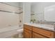 Cozy bathroom featuring a bathtub with shower and a single sink vanity with granite countertop at 3531 Oriskany Dr, Orlando, FL 32820
