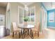 Dining area with round table, two chairs and natural light at 3531 Oriskany Dr, Orlando, FL 32820