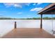 Waterfront dock view featuring expansive lake views and a boat lift for water access at 3531 Oriskany Dr, Orlando, FL 32820