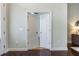 Hallway with open doorway into another room showing hardwood floors at 3531 Oriskany Dr, Orlando, FL 32820