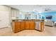 Kitchen island with sink, granite counters, stainless dishwasher and breakfast bar at 3531 Oriskany Dr, Orlando, FL 32820
