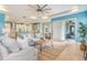Spacious living room connected to an open-concept kitchen and dining area, perfect for entertaining at 3531 Oriskany Dr, Orlando, FL 32820