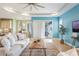 Open-concept living room with access to the kitchen, dining area, and a patio with sliding glass doors at 3531 Oriskany Dr, Orlando, FL 32820