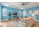 Living room with large sectional couch, large window, ceiling fan and recessed lighting at 3531 Oriskany Dr, Orlando, FL 32820