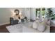 Comfortable living room with modern furnishings, stylish rug, and sliding glass doors with view to exterior at 3531 Oriskany Dr, Orlando, FL 32820