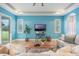 Bright living room featuring blue walls, a ceiling fan, and natural light from a sliding glass door at 3531 Oriskany Dr, Orlando, FL 32820