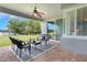 Relaxing outdoor patio featuring brick flooring, ceiling fan, and picturesque views of lake at 3531 Oriskany Dr, Orlando, FL 32820