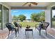Inviting covered patio overlooking a lush lawn with lake views and comfortable seating at 3531 Oriskany Dr, Orlando, FL 32820