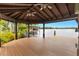 Lakeside pavilion with a wood deck, offering serene water views and a tranquil atmosphere at 3531 Oriskany Dr, Orlando, FL 32820