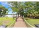 Picturesque walkway with rope railings leading to the lake and dock area at 3531 Oriskany Dr, Orlando, FL 32820