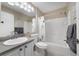 Bathroom with neutral decor, granite countertop, and shower-tub combo at 3531 Reston Dr, The Villages, FL 32162