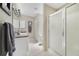 Clean and modern bathroom with a walk-in shower, sleek fixtures, and ample storage space at 3531 Reston Dr, The Villages, FL 32162