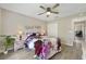 Bedroom with wood-look flooring, ceiling fan, and closet for storage at 3531 Reston Dr, The Villages, FL 32162