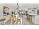 Open-concept dining area that flows into the living room and kitchen, creating an inviting atmosphere at 3531 Reston Dr, The Villages, FL 32162