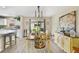 Tastefully decorated dining room with sliding glass doors, neutral color palette, and stylish furnishings at 3531 Reston Dr, The Villages, FL 32162