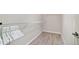 Walk-in closet with vinyl floor and white wire shelving for organized storage at 3531 Reston Dr, The Villages, FL 32162