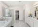 Bright bathroom featuring tiled floors, stand-up shower, and walk-in closet at 3866 Cabo Rojo Dr, St Cloud, FL 34772