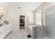 Bright bathroom showcasing the shower, bathtub, and access to the main bedroom at 3866 Cabo Rojo Dr, St Cloud, FL 34772