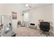 Cozy bedroom with a ceiling fan, soft carpet, neutral colors and a sitting area for relaxation at 3866 Cabo Rojo Dr, St Cloud, FL 34772