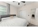 Bedroom featuring carpet, large window, and easy access to the closet and hallway at 3866 Cabo Rojo Dr, St Cloud, FL 34772