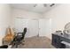 Bedroom featuring neutral colored walls, ceiling fan, large closet, carpet floors, and an ensuite bathroom at 3866 Cabo Rojo Dr, St Cloud, FL 34772