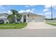 Charming single-Gathering home with a well-manicured lawn, complemented by a convenient two-car garage and a beautiful palm tree at 3866 Cabo Rojo Dr, St Cloud, FL 34772