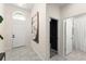 Inviting entryway featuring tiled flooring, a modern light fixture and an adjacent art piece at 3866 Cabo Rojo Dr, St Cloud, FL 34772