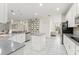 Bright, open kitchen featuring an island, stainless steel appliances, and white cabinetry at 3866 Cabo Rojo Dr, St Cloud, FL 34772