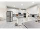 Modern kitchen with stainless steel appliances, central island, and sleek gray countertops at 3866 Cabo Rojo Dr, St Cloud, FL 34772