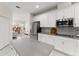 Well-appointed kitchen with stainless steel appliances and a clear view into the living area at 3866 Cabo Rojo Dr, St Cloud, FL 34772