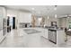 Open concept kitchen featuring stainless steel appliances, an island, and stylish finishes at 3866 Cabo Rojo Dr, St Cloud, FL 34772