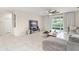 Spacious living room boasts tile flooring, natural light, and access to the outdoor space at 3866 Cabo Rojo Dr, St Cloud, FL 34772