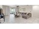 Large living room with tile floors, comfortable seating, and a ceiling fan at 3866 Cabo Rojo Dr, St Cloud, FL 34772