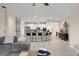 Bright living room with view of the eat-in kitchen featuring stainless appliances and bar seating at 3866 Cabo Rojo Dr, St Cloud, FL 34772