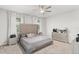 Well-lit main bedroom featuring large upholstered headboard and matching dressers at 3866 Cabo Rojo Dr, St Cloud, FL 34772