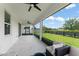 Comfortable screened-in patio provides serene views of the backyard and black fenced perimeter at 3866 Cabo Rojo Dr, St Cloud, FL 34772