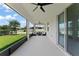 Spacious screened-in patio, ideal for entertaining and enjoying serene views of the backyard at 3866 Cabo Rojo Dr, St Cloud, FL 34772
